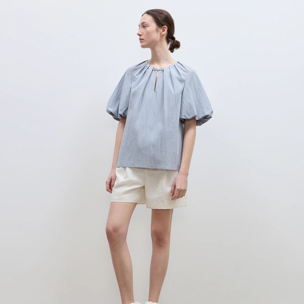 
                  
                    "Iceland Diary" neckline pleated design round neck tie puff sleeve short sleeve shirt for women
                  
                